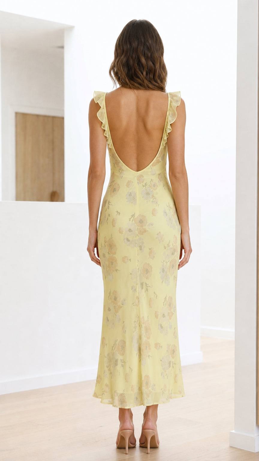 Back view of yellow floral maxi dress showing low scoop back