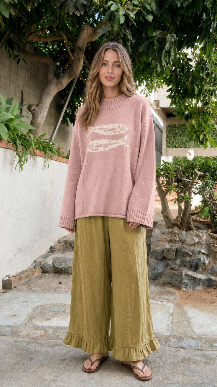 Front view of model wearing Dusty Pink fish graphic knit pullover sweater