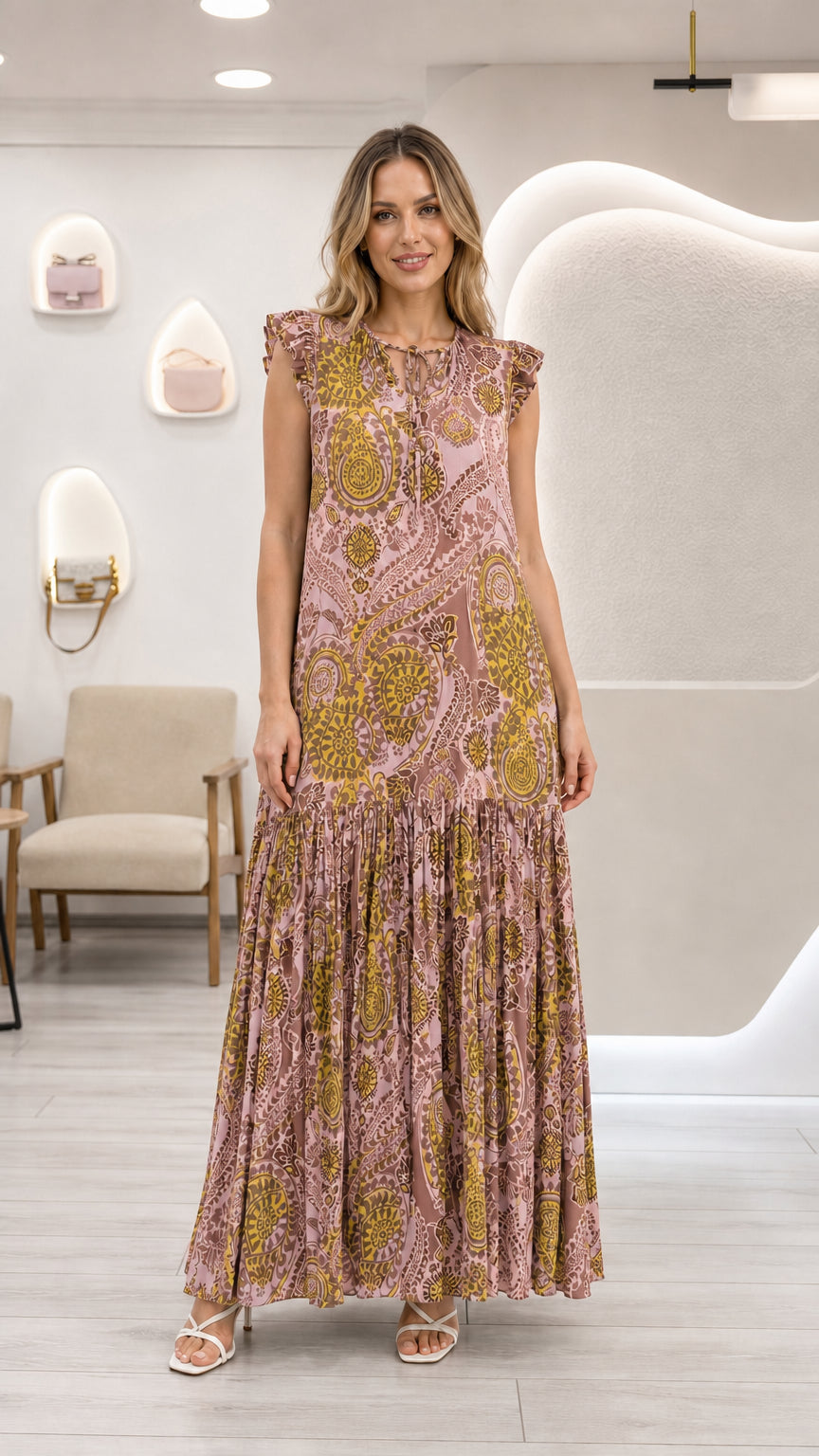 Full front view of model wearing dusty pink paisley tiered maxi dress